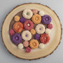 Colorful flowers arranged on a wooden surface 
