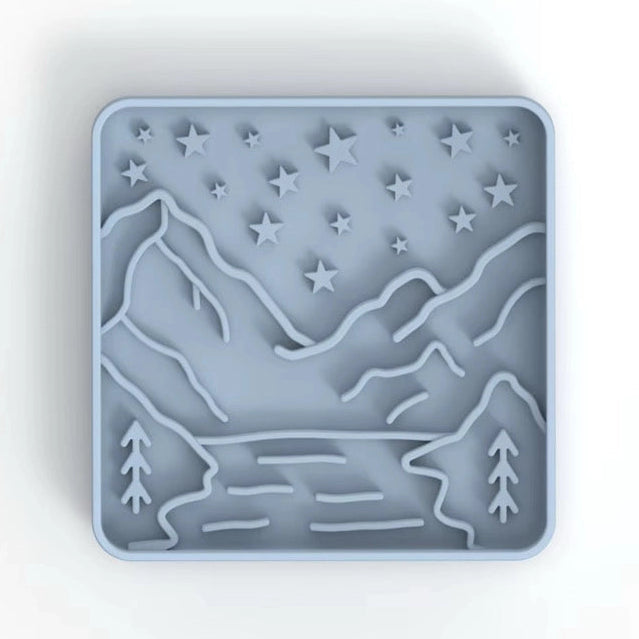Silicone mold with mountain and star design on a white background
