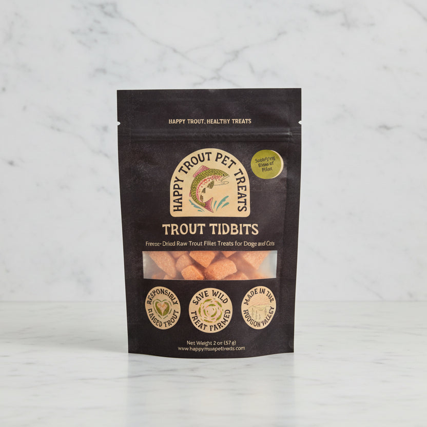 Happy Trout Pet Treats Trout Tidbits package against a natural background