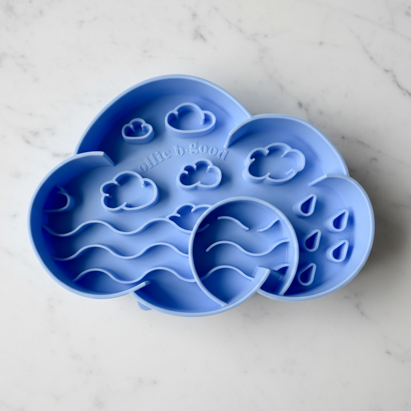 Blue silicone mold shaped like a cloud on a white background