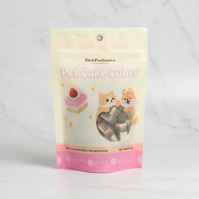 Package of Pet Cake Cubes with cartoon dogs and cake illustration on a white background