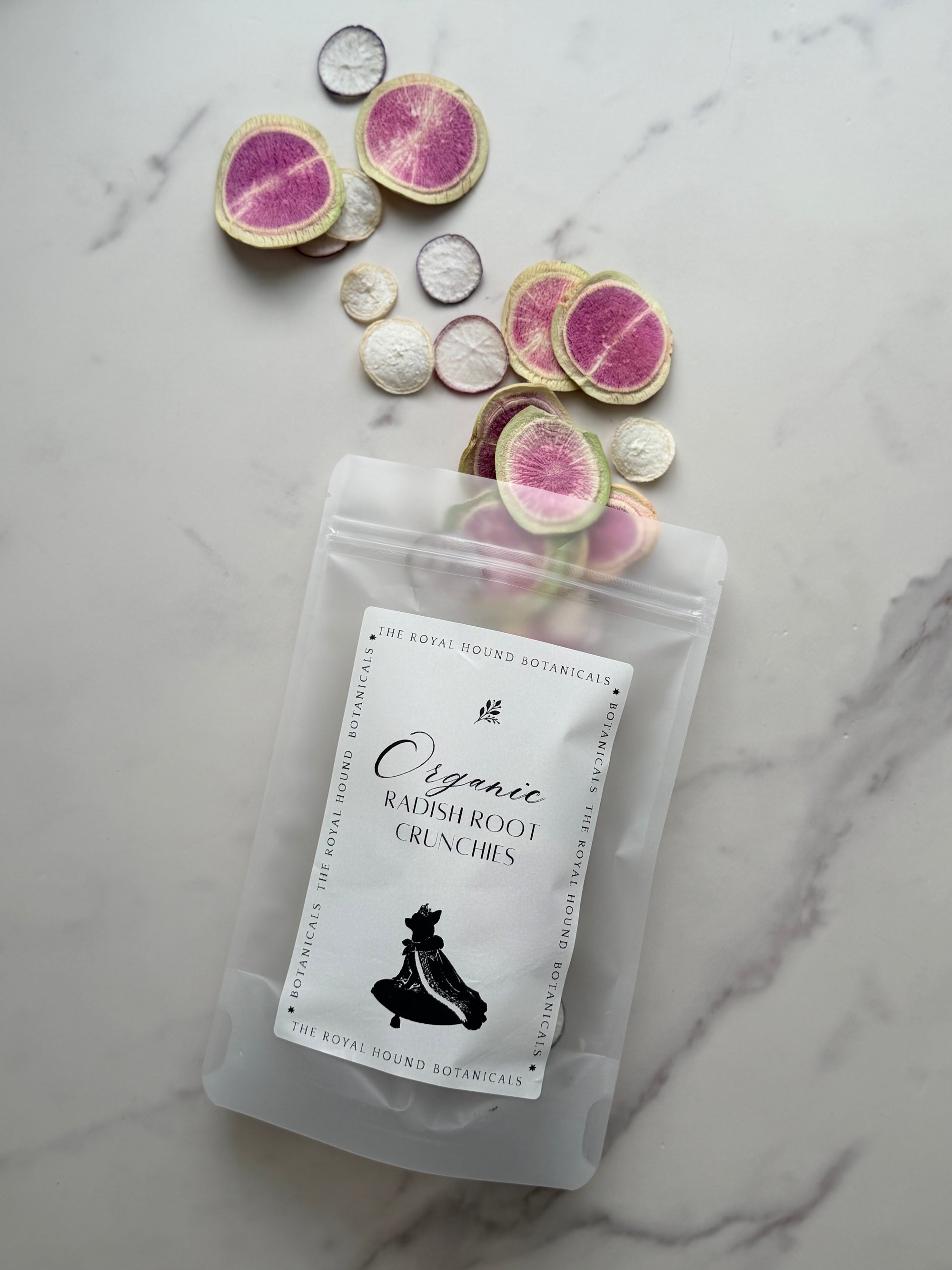 Packaged organic radishroot crunchies on a marble surface