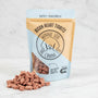 Package of Bison Heart Tidbits by Winnie Lou the Canine Co. with visible treats on a white background