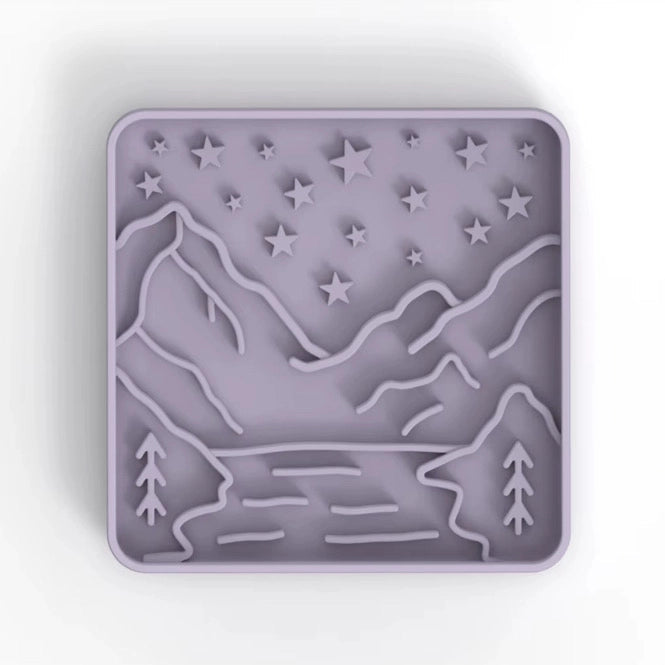 Silicone mold with mountain and star design on a white background